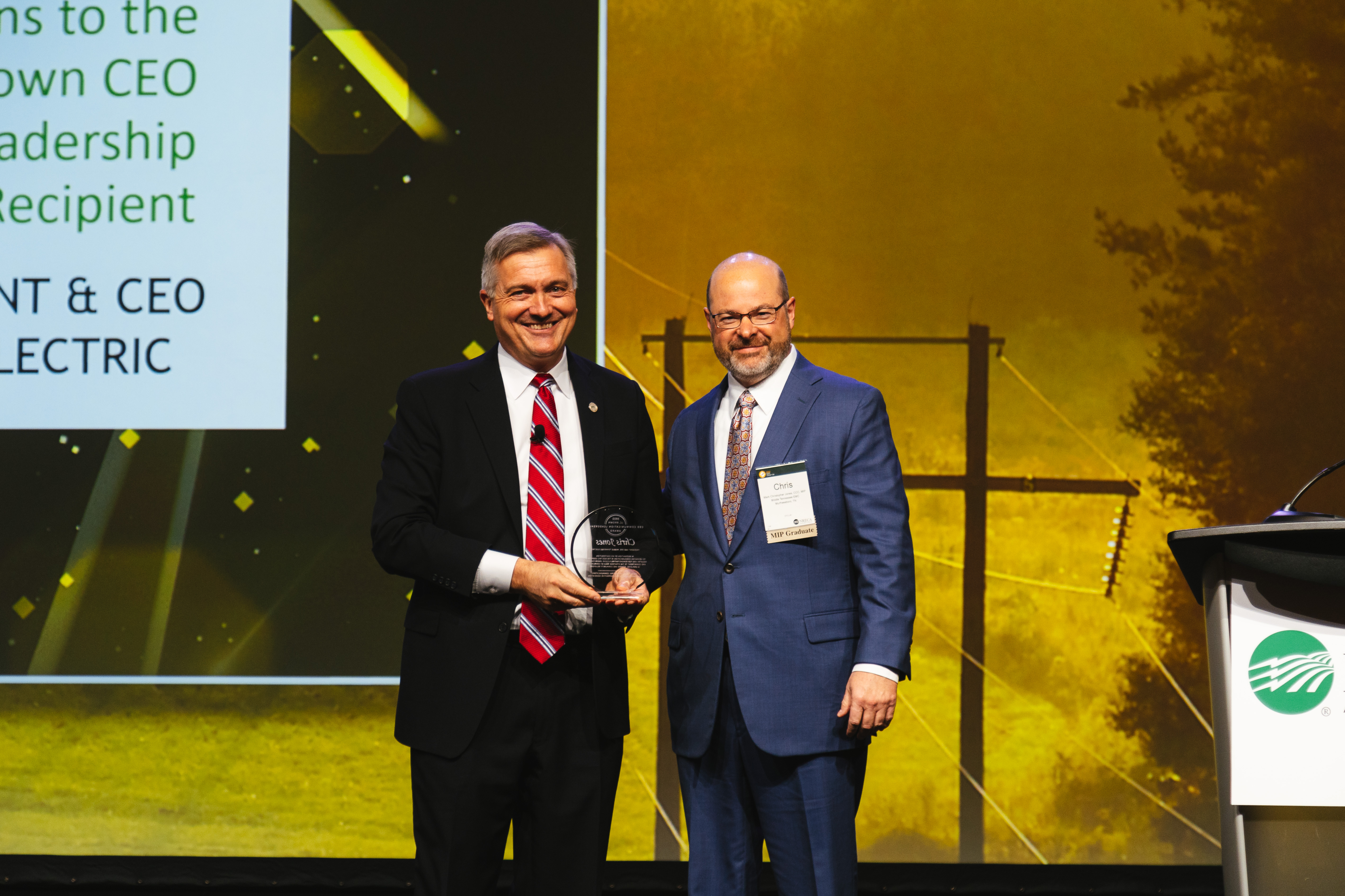Middle Tennessee Electric President and CEO Chris Jones receives the 2022 J.C. Brown CEO Communication Leadership Award at CEO Close-Up in Phoenix from NRECA President Jim Matheson..